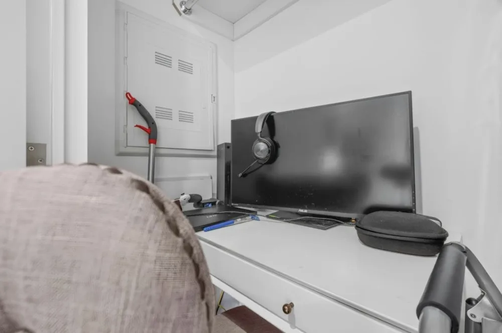 Small desk with computer setup.