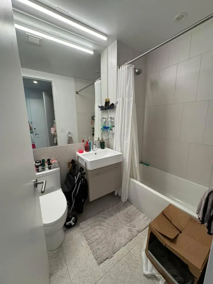 Modern bathroom with white tiles.