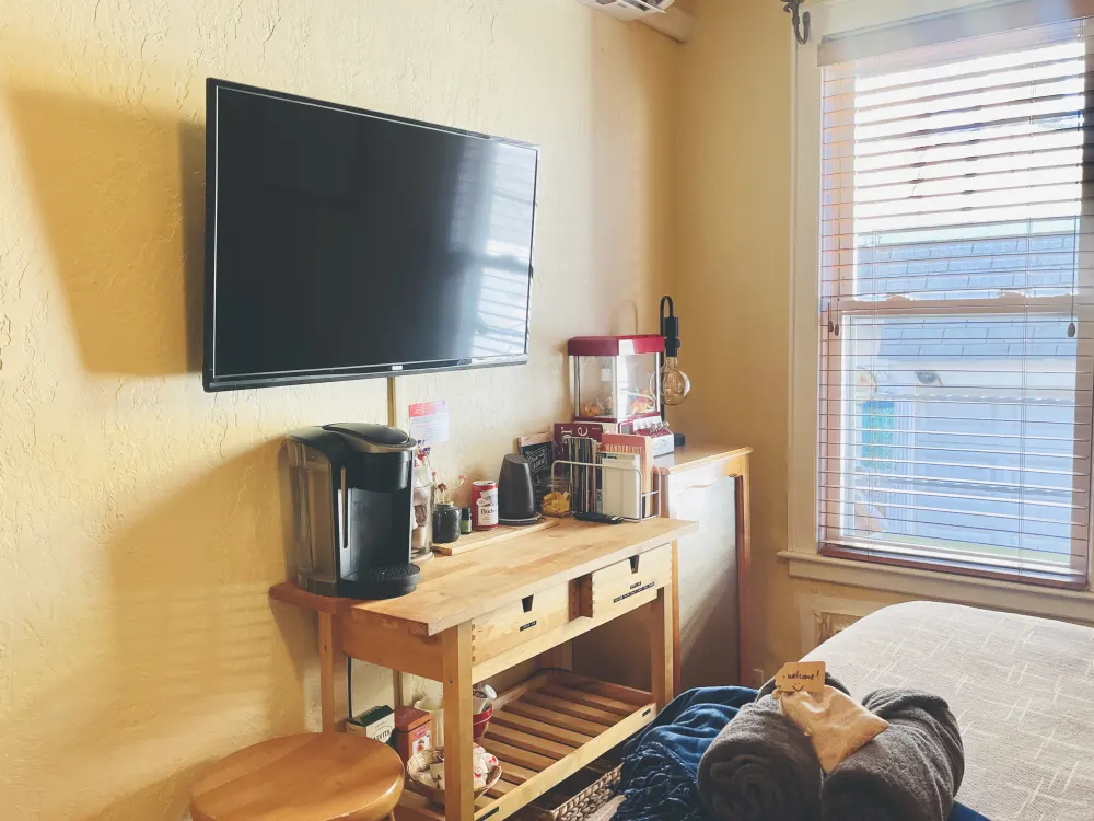 Cozy room with TV and window.