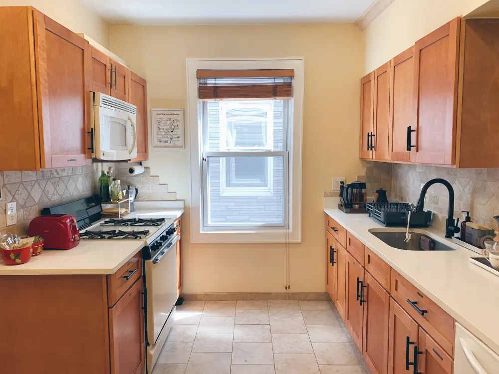 Warm, cozy kitchen with window.