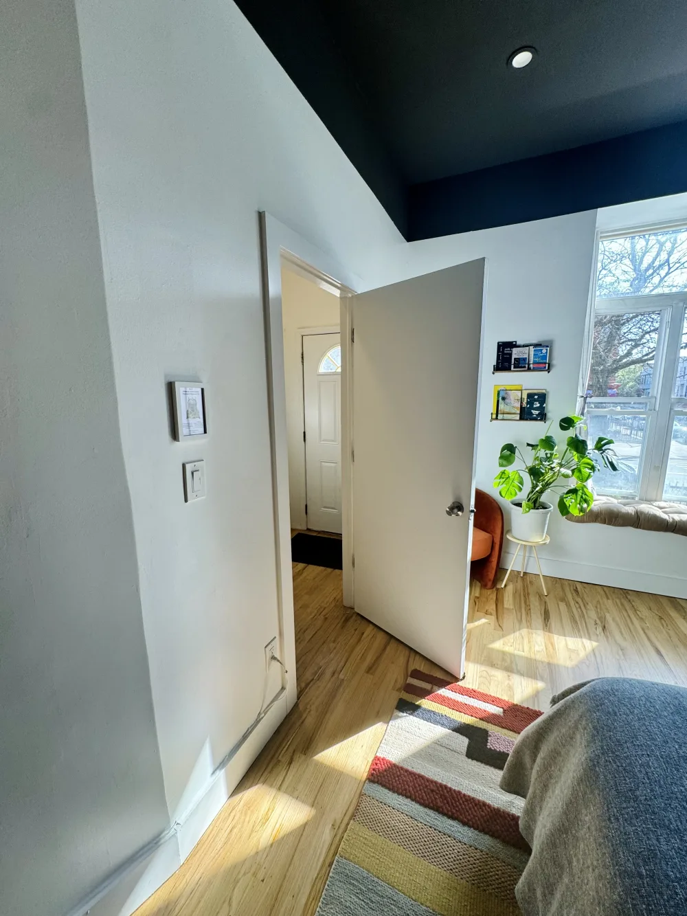 Cozy bedroom with open door.