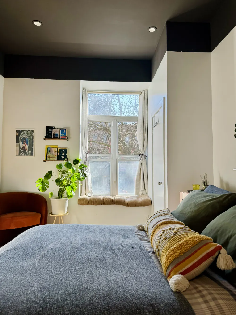 Cozy bedroom with sunny window.