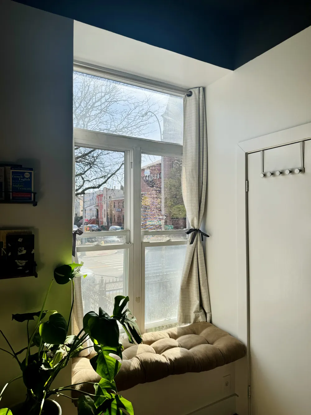 Cozy window nook with sunlight.
