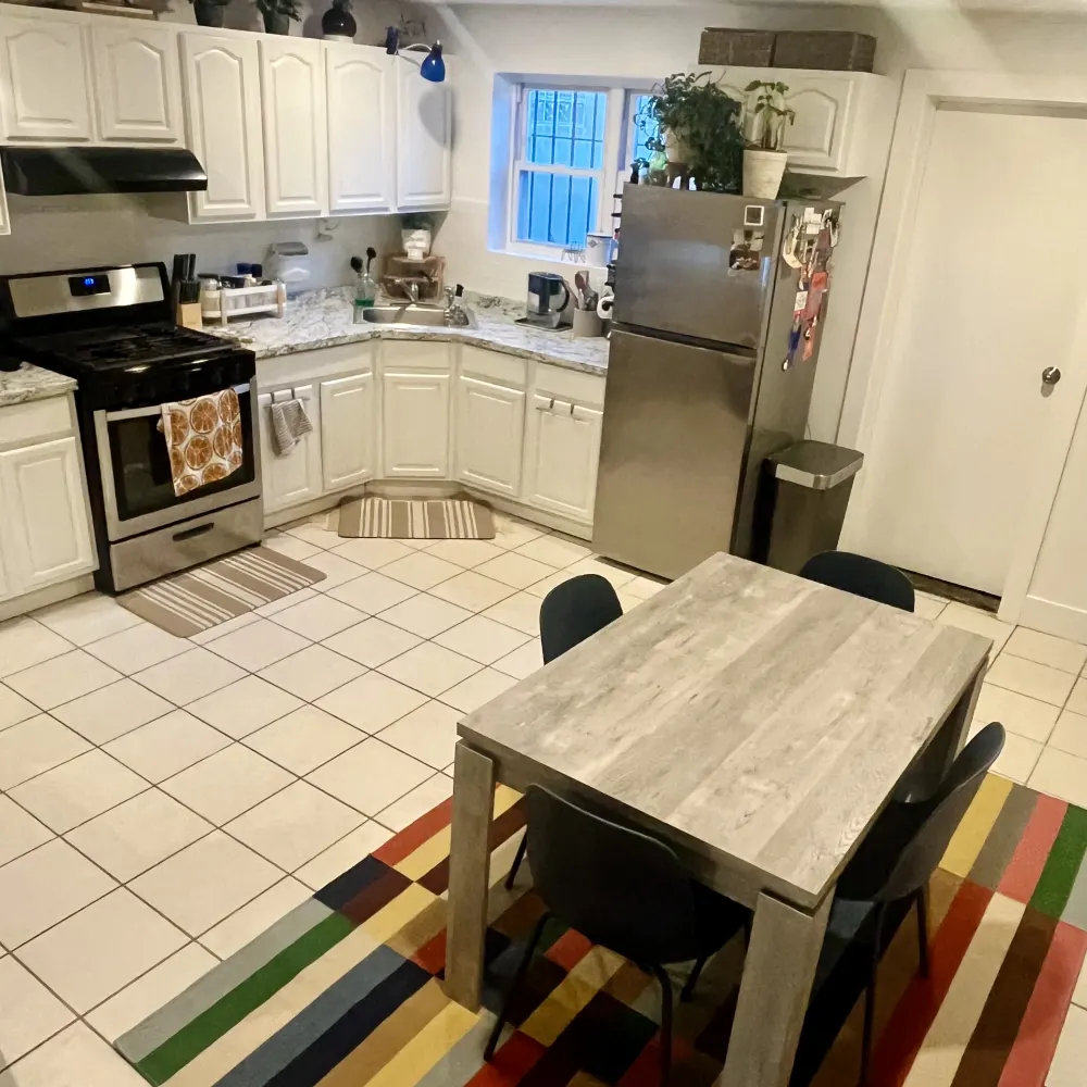 Modern kitchen with dining table.