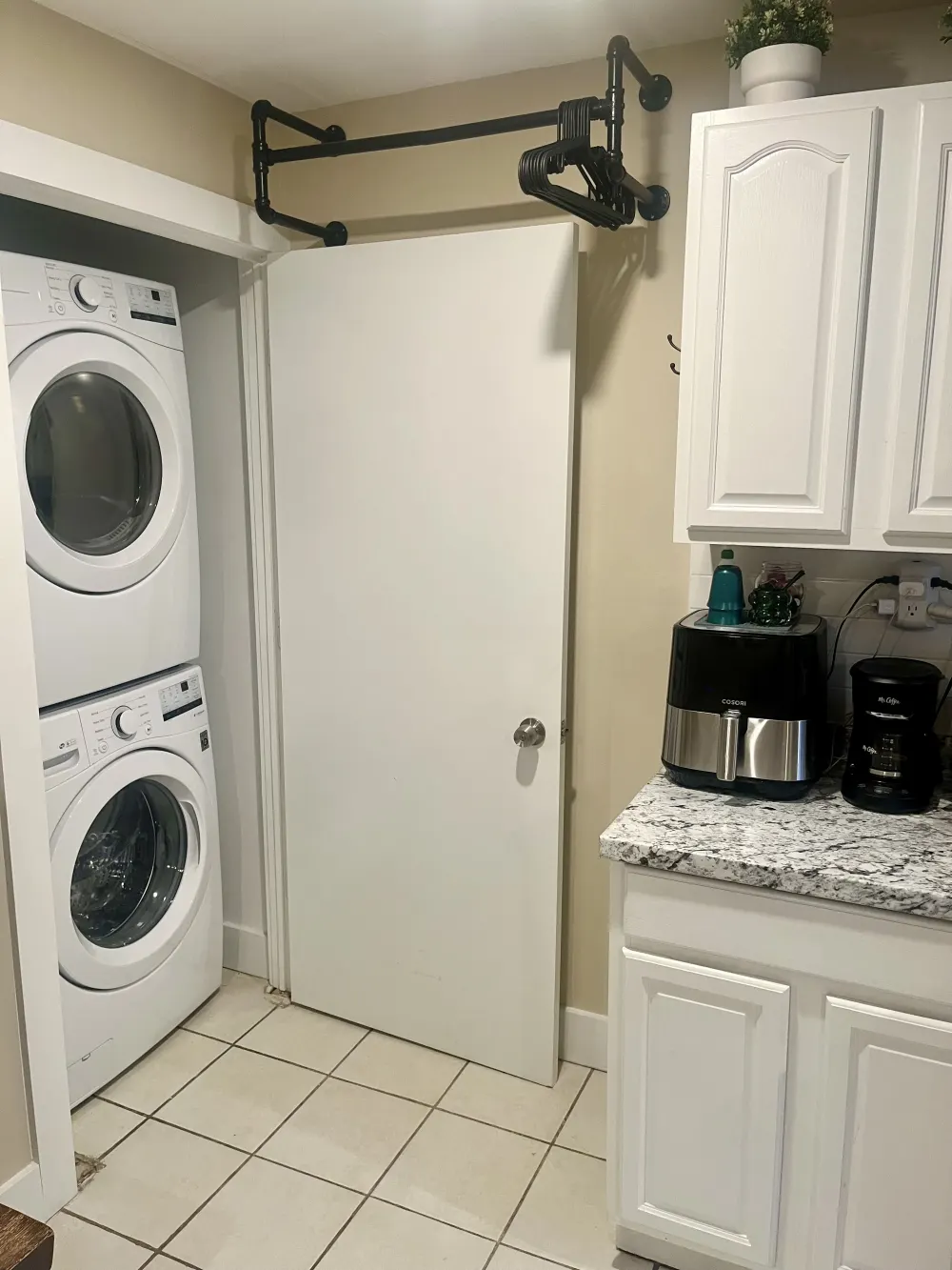 Laundry room with appliances and counter.