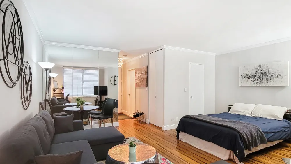 Modern studio apartment with minimalist decor.