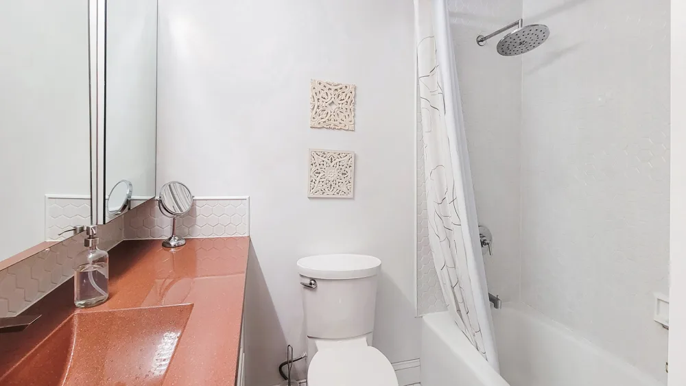 Modern bathroom with white decor.