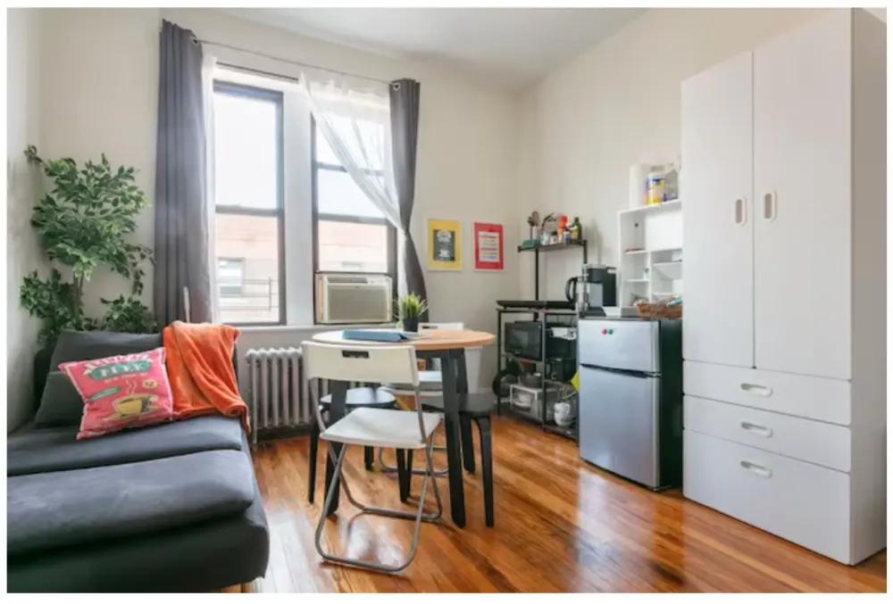 Compact studio with cozy furnishings.