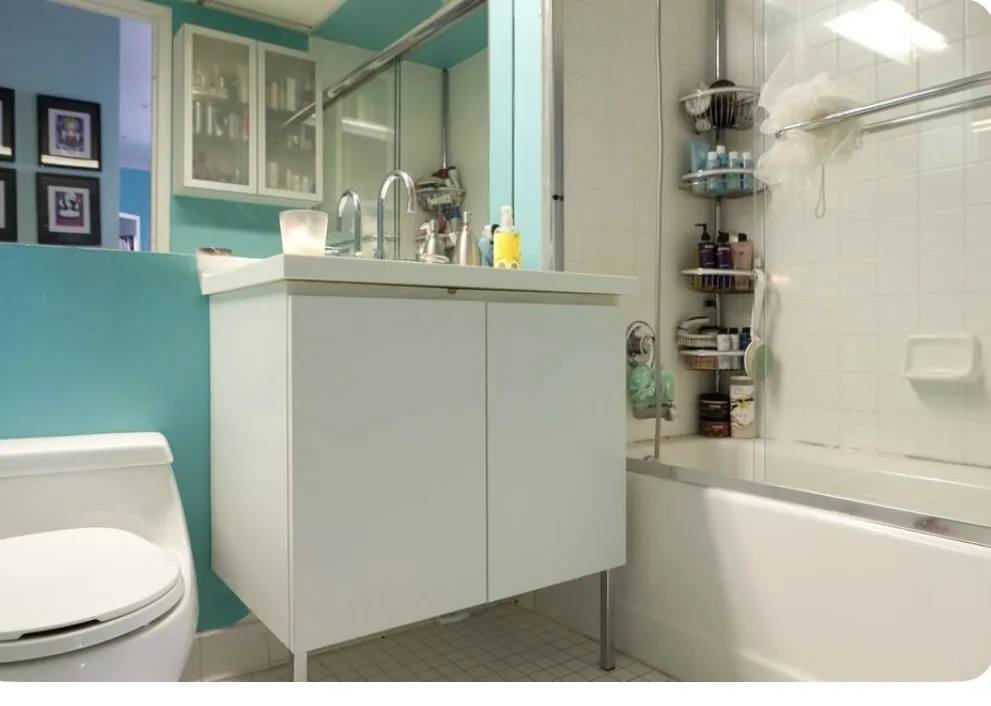 Modern bathroom with aqua walls.