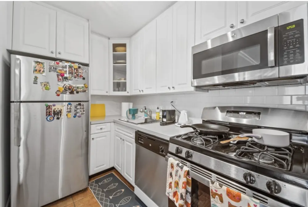 Modern kitchen with stainless appliances.