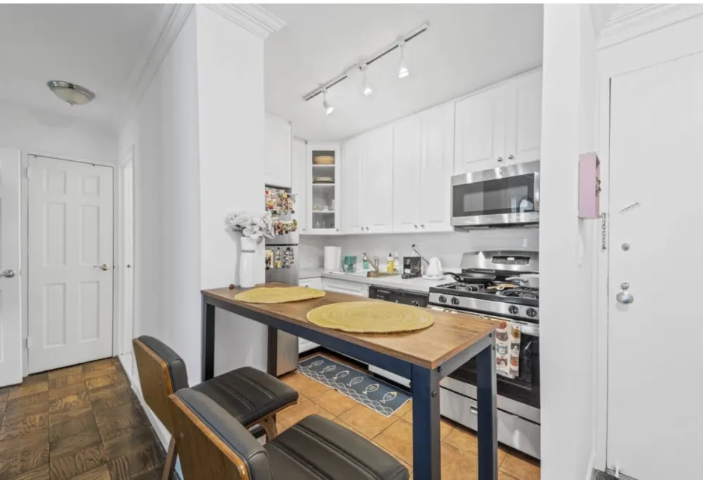 Compact modern kitchen with seating.