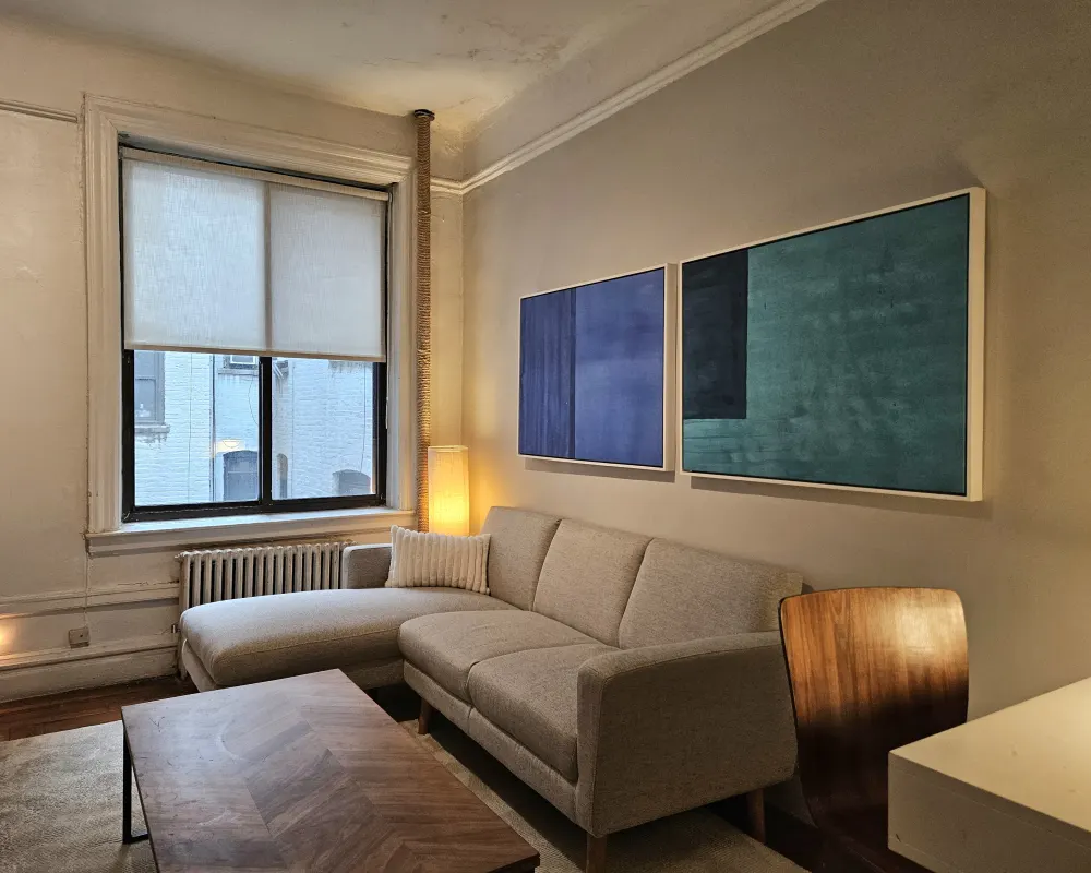 Modern living room with abstract artwork.