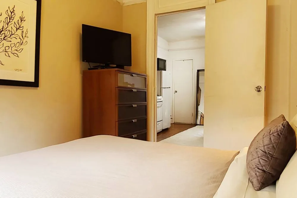 Cozy bedroom with modern amenities.