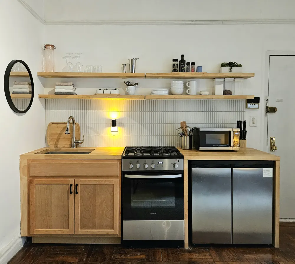 Modern minimalist kitchen with appliances.