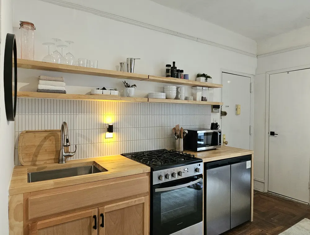 Modern minimalist kitchen with open shelves.