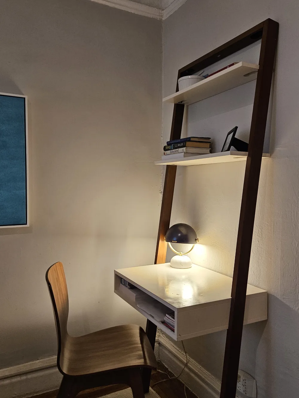 Cozy corner desk with lamp.