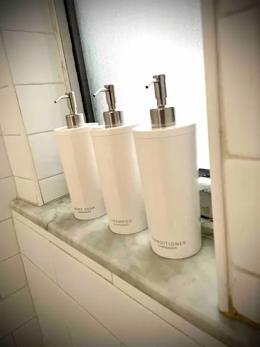 Minimalist toiletries in bathroom window.