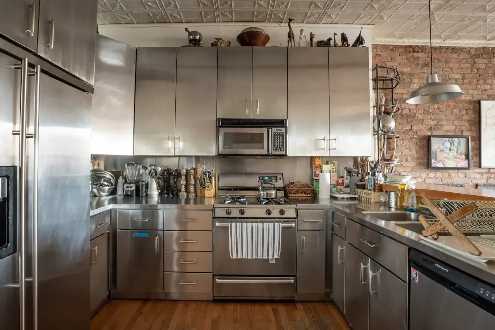 Modern industrial-style kitchen with brick.