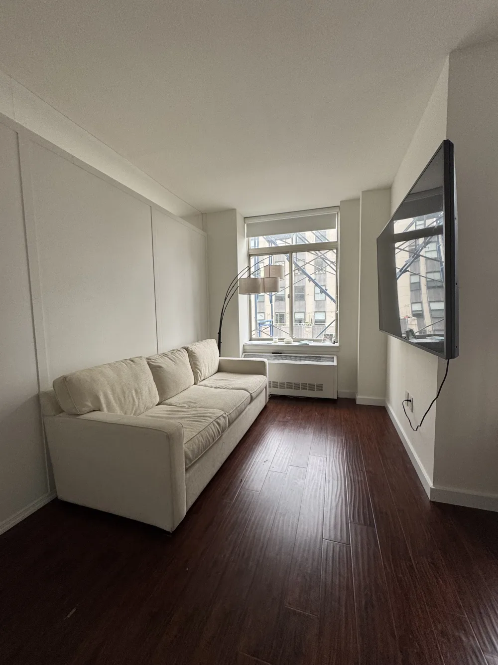 Minimalist room with beige couch.