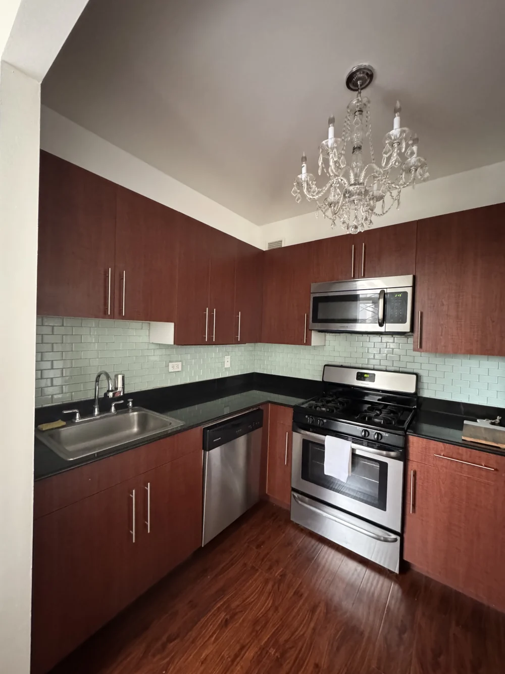 Modern kitchen with glass chandelier.