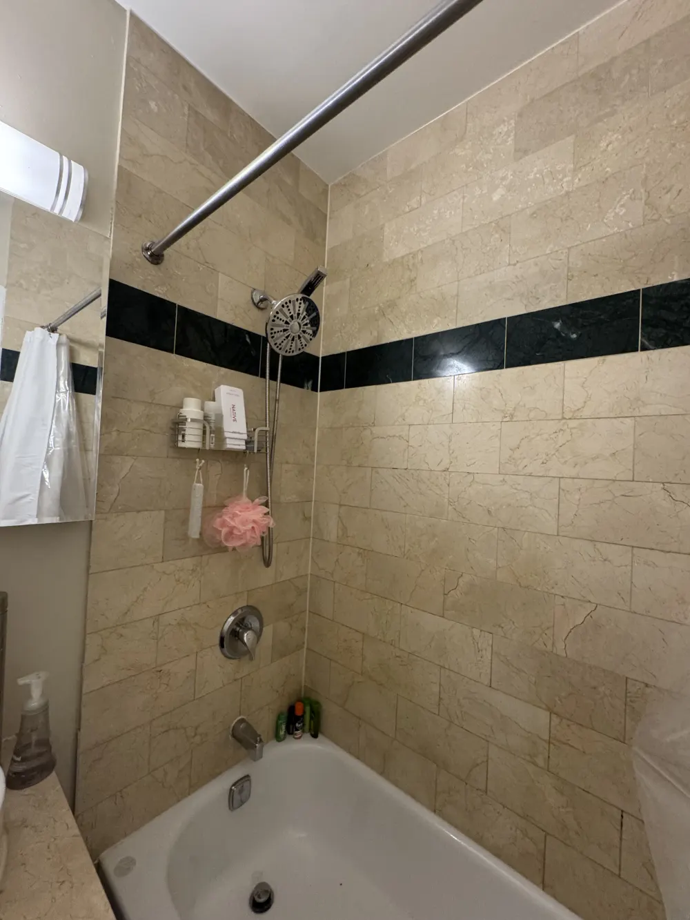 Modern bathroom with tiled shower.