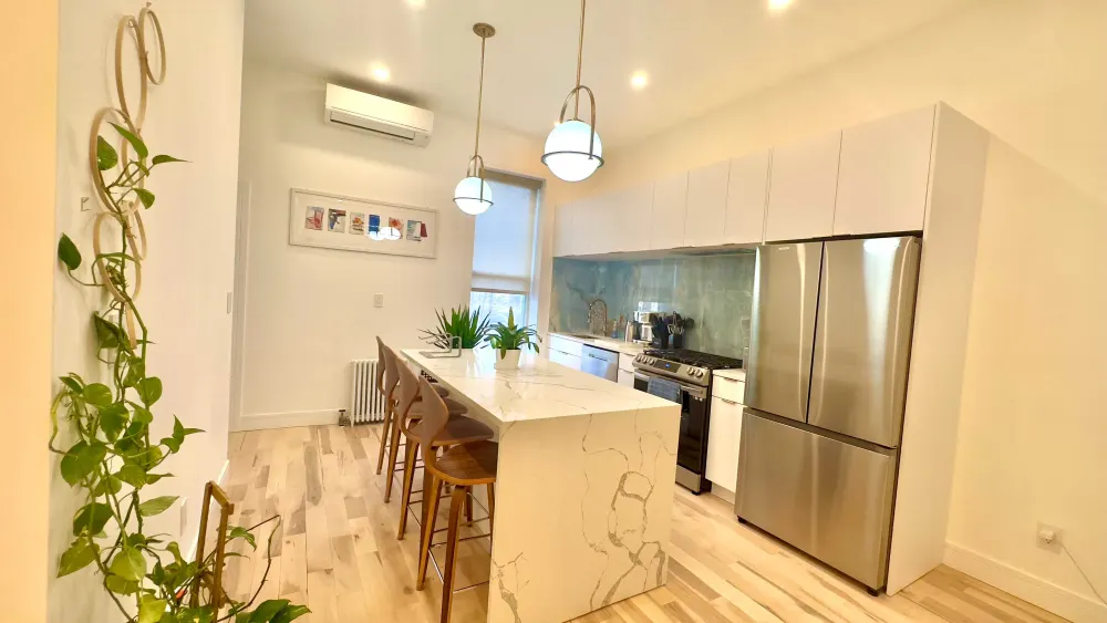 Modern kitchen with marble island.
