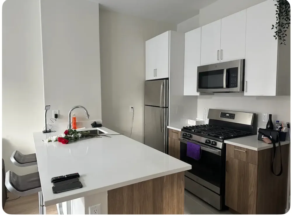 Modern kitchen with white countertops.