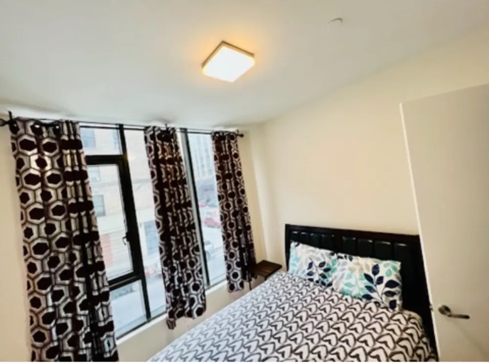 Cozy bedroom with patterned decor.