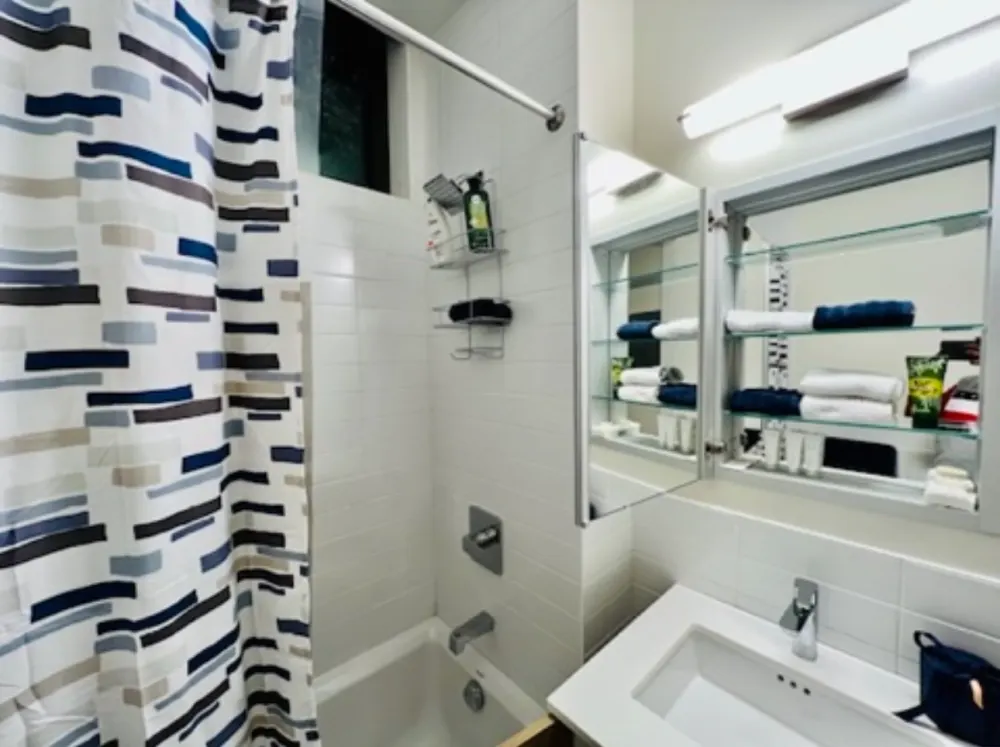 Modern bathroom with white tiles.
