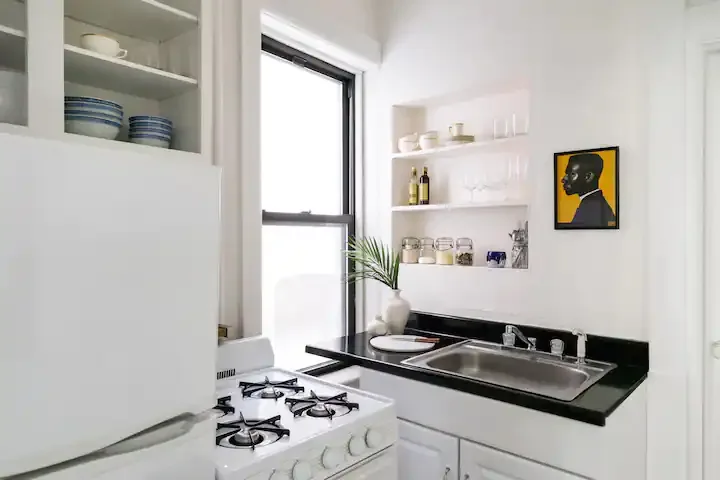 Cozy kitchen with white decor.
