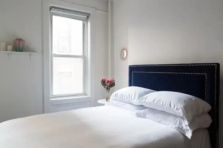 Bright room with cozy bed.