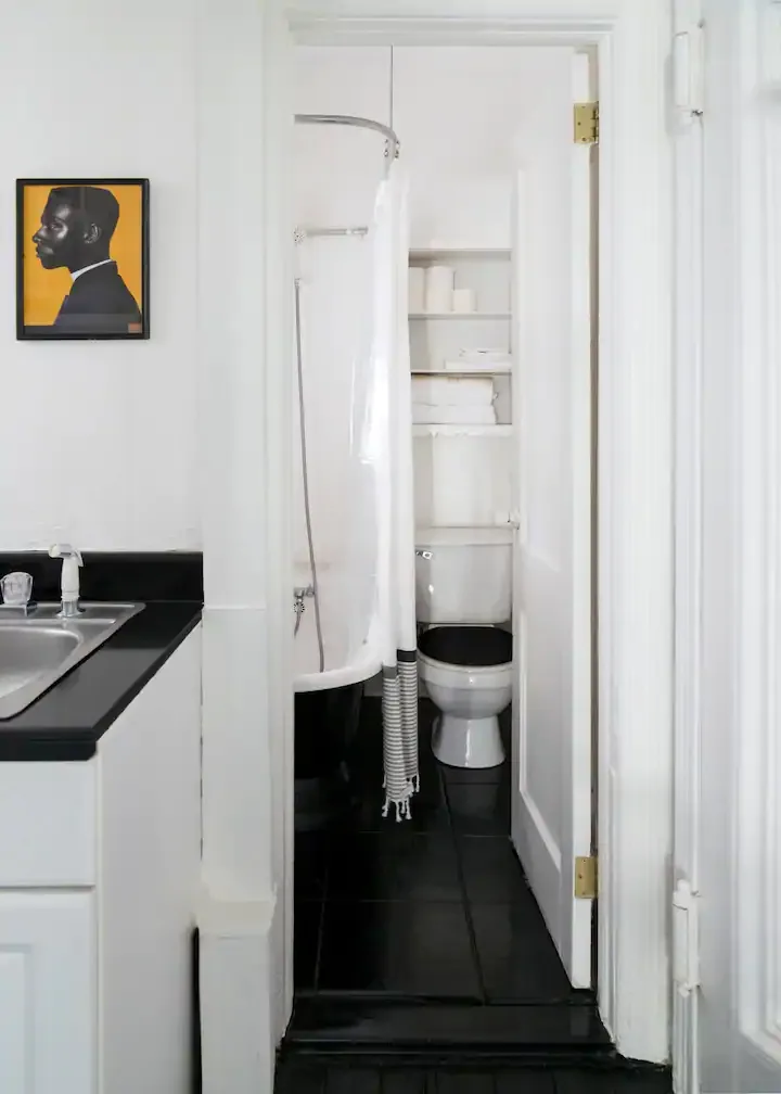 Compact bathroom with monochromatic decor.