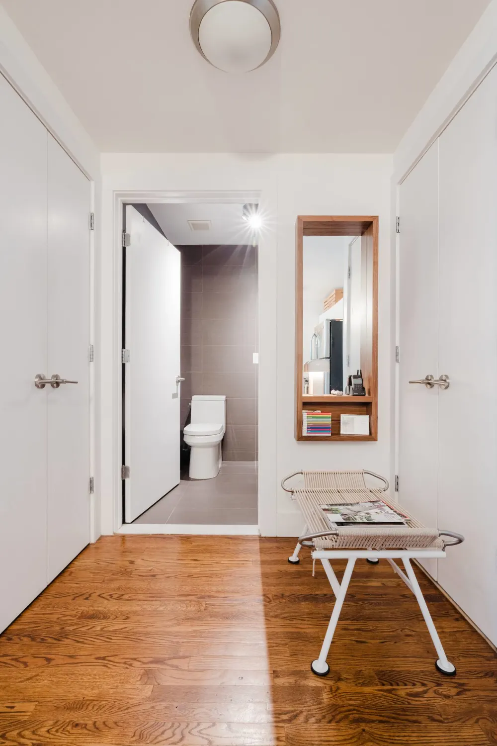 Modern hallway with wooden floors.