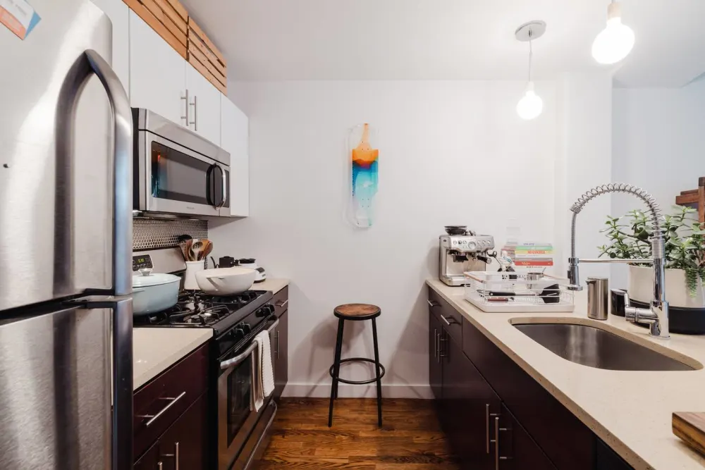 Modern kitchen with stainless steel appliances.