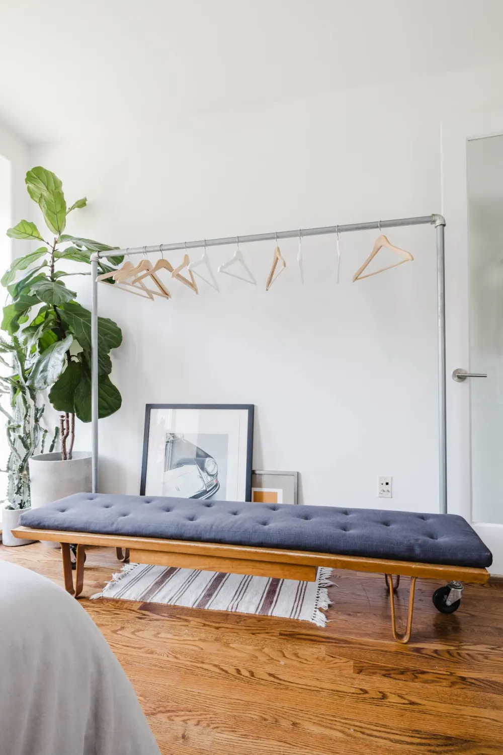 Minimalist bedroom with bench seating.