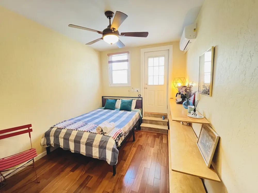 Cozy bedroom with striped bedding.