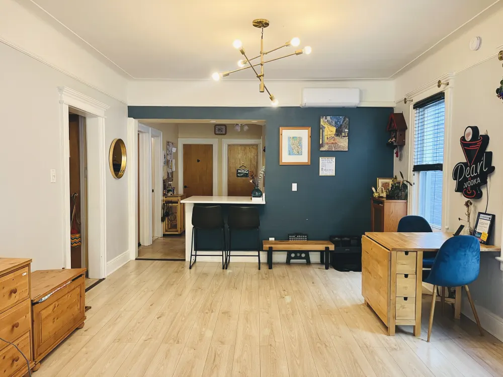 Modern, cozy apartment with workspace.