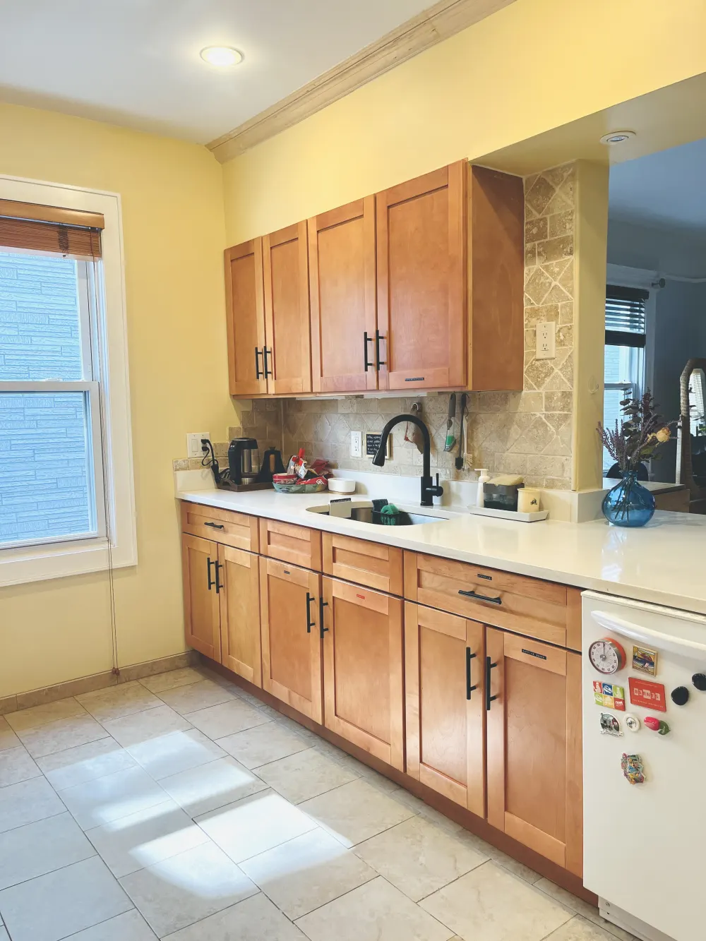 Cozy kitchen with wooden cabinets.