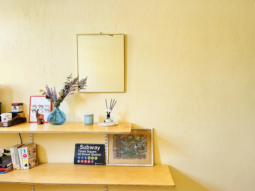 Decorative shelf with various items.