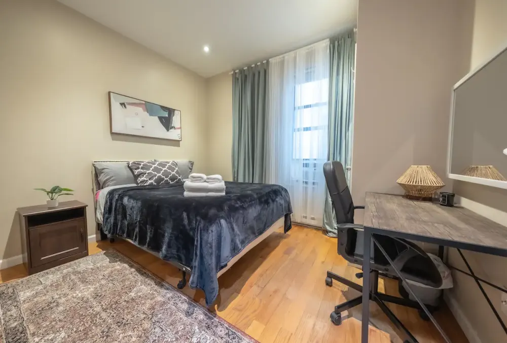 Cozy bedroom with modern furnishings.