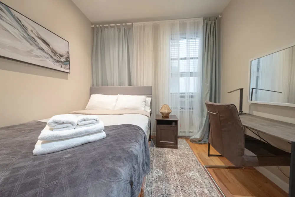 Cozy bedroom with a desk.