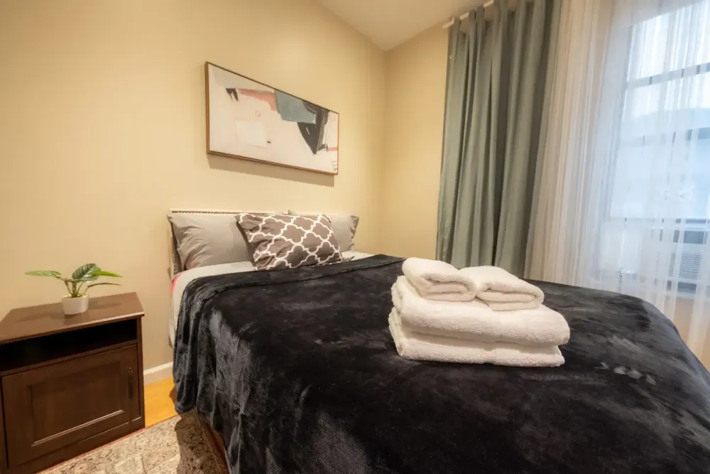 Cozy bedroom with plush bed.