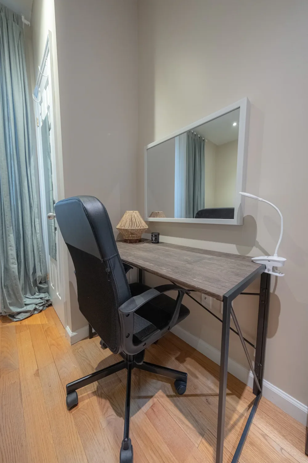Compact workspace with chair and desk.