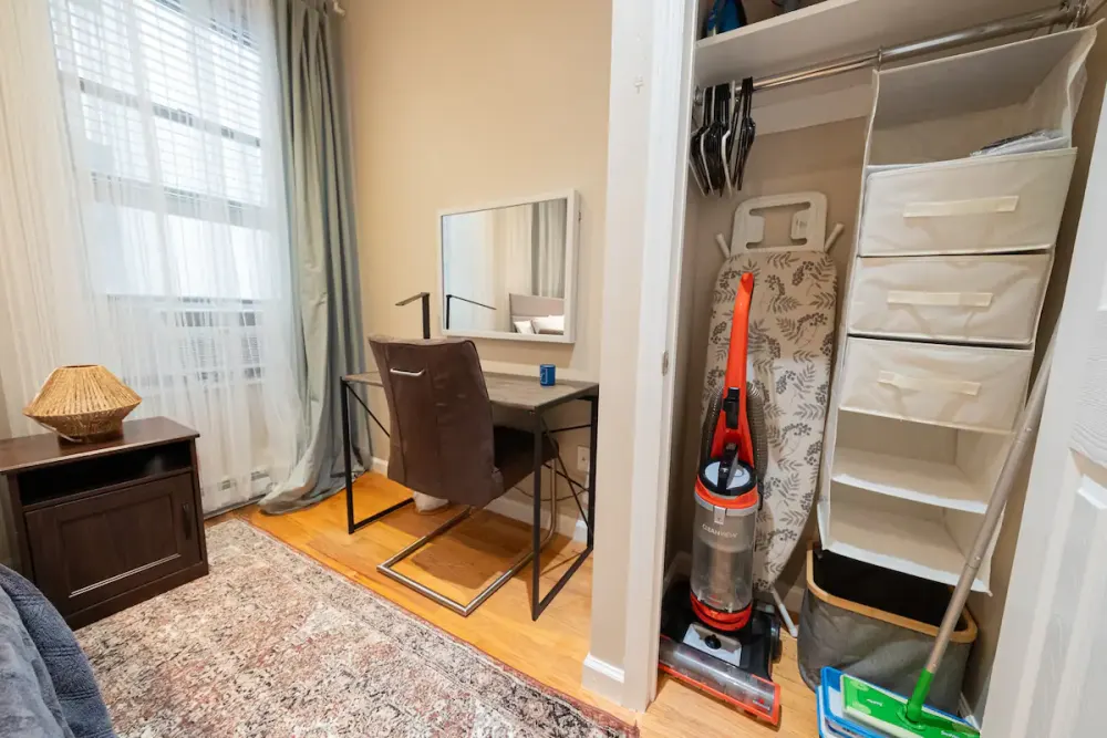 Comfortable workspace with closet storage.