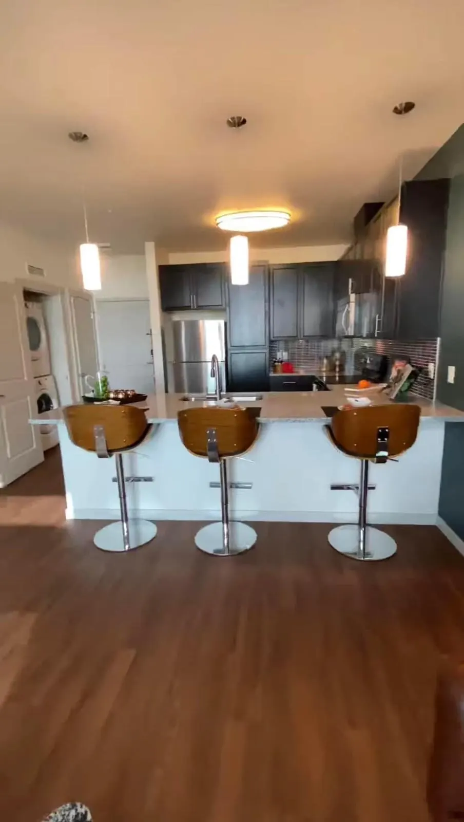 Modern kitchen with bar seating.