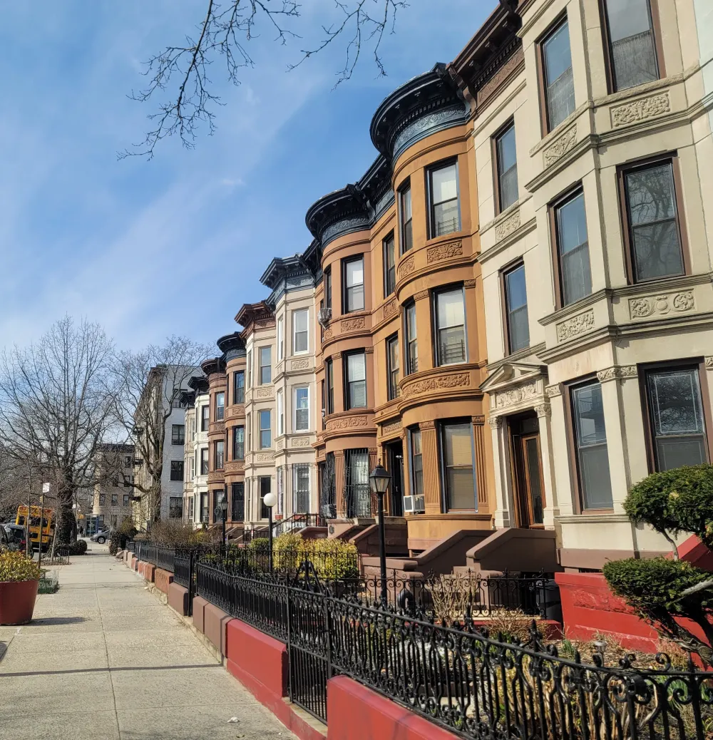 Row of colorful brownstone houses.