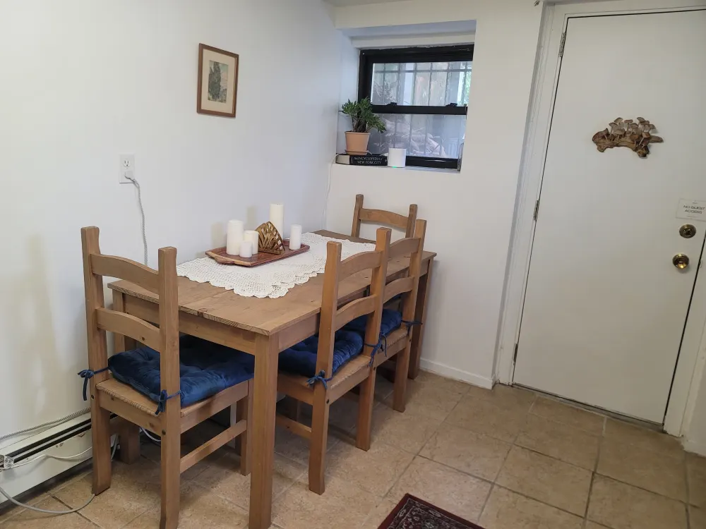 Cozy dining area with table.