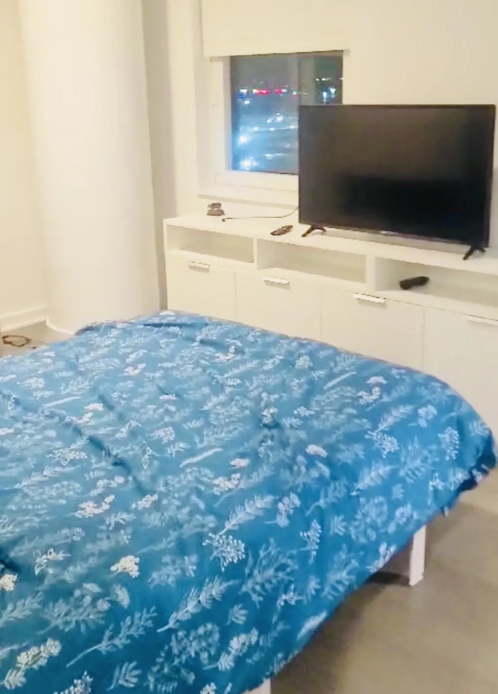 Cozy bedroom with blue bedding