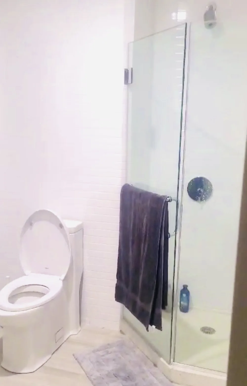 Clean bathroom with glass shower