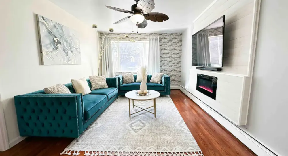 Modern living room with teal sofas.